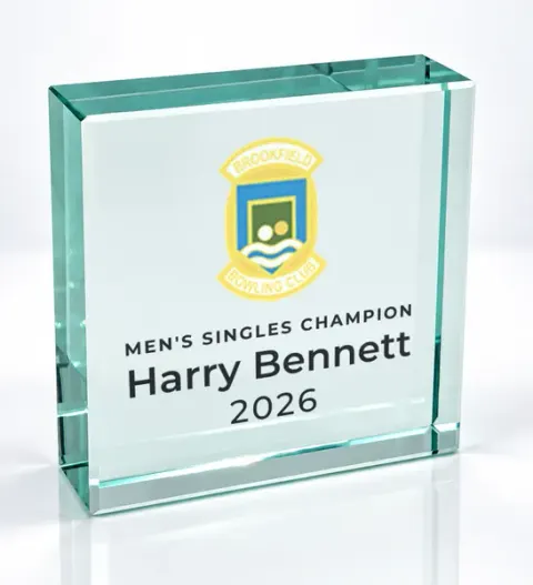 Small square glass award printed with a club crest and the wording Men'S Singles Champion, Harry Bennett, 2026
