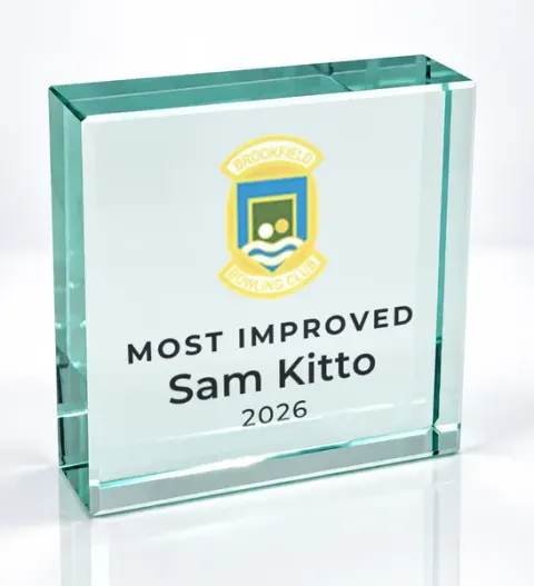 Small square glass award printed with a club crest and the wording Most Improved, Sam Kitto, 2026