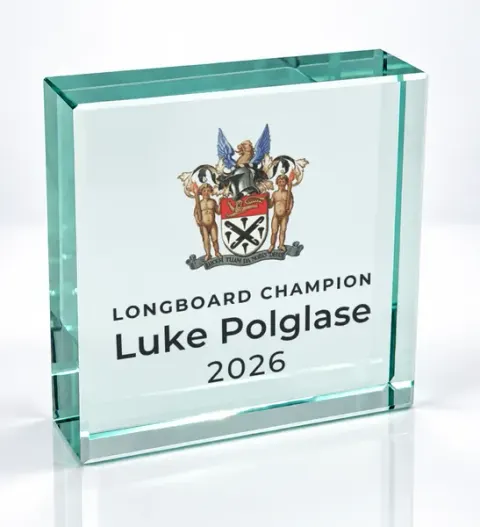 Small square glass award printed with a club crest and the wording Longboard Champion, Luke Polglase, 2026