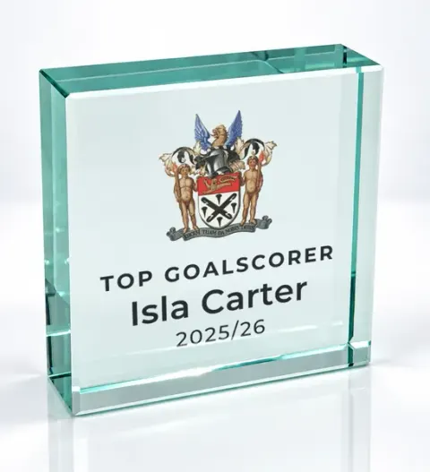 Small square glass award printed with a club crest and the wording Top Goalscorer, Isla Carter, 2025/26
