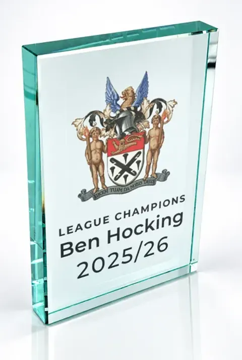 Large portrait glass award printed with a club crest and the wording League Champions, Ben Hocking, 2025/26