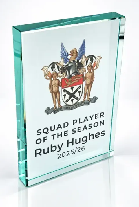 Large portrait glass award printed with a club crest and the wording Squad Player Of The Season, Ruby Hughes, 2025/26