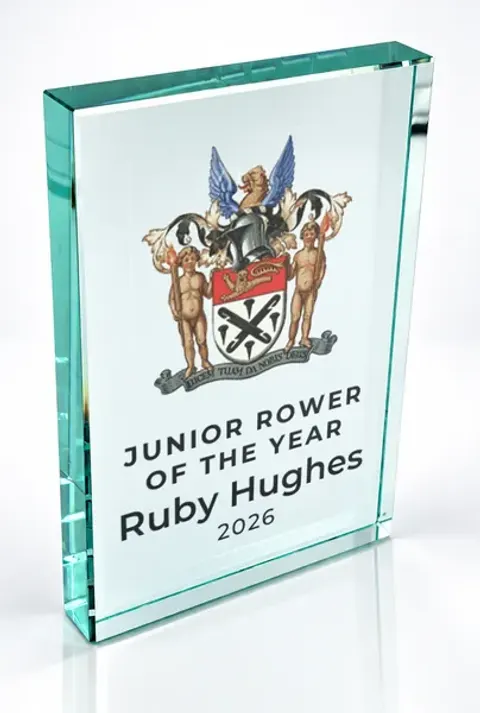 Large portrait glass award printed with a club crest and the wording Junior Rower Of The Year, Ruby Hughes, 2026