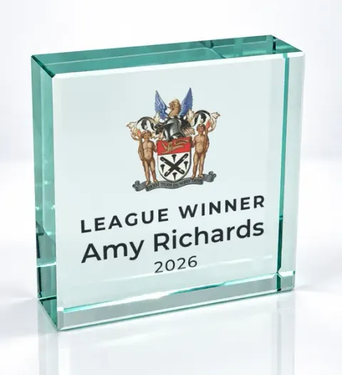 Small square glass award printed with a club crest and the wording League Winner, Amy Richards, 2026