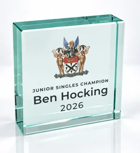 Small square glass award printed with a club crest and the wording Junior Singles Champion, Ben Hocking, 2026