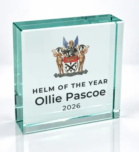 Small square glass award printed with a club crest and the wording Helm Of The Year, Ollie Pascoe, 2026