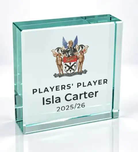 Small square glass award printed with a club crest and the wording Players' Player, Isla Carter, 2025/26