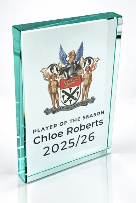 Large portrait glass award printed with a club crest and the wording Player Of The Season, Chloe Roberts, 2025/26
