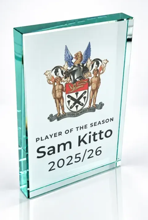 Large portrait glass award printed with a club crest and the wording Player Of The Season, Sam Kitto, 2025/26