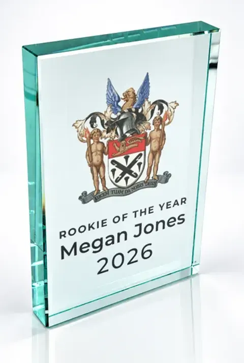 Large portrait glass award printed with a club crest and the wording Rookie Of The Year, Megan Jones, 2026