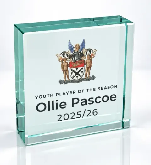 Small square glass award printed with a club crest and the wording Youth Player Of The Season, Ollie Pascoe, 2025/26