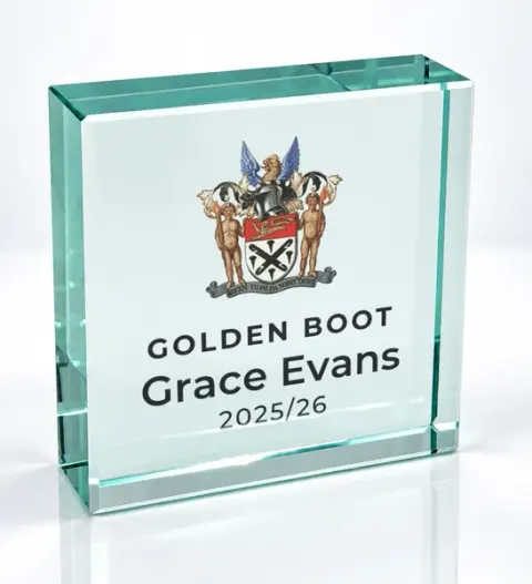 Small square glass award printed with a club crest and the wording Golden Boot, Grace Evans, 2025/26