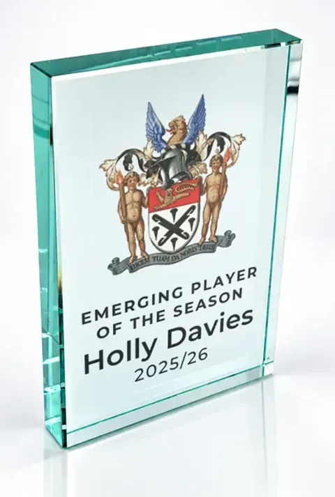 Large portrait glass award printed with a club crest and the wording Emerging Player Of The Season, Holly Davies, 2025/26