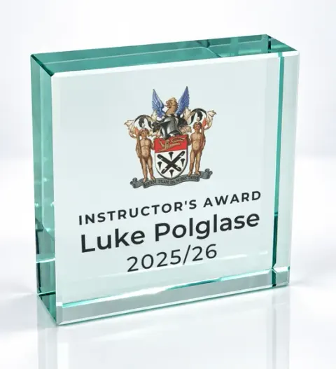 Small square glass award printed with a club crest and the wording Instructor'S Award, Luke Polglase, 2025/26