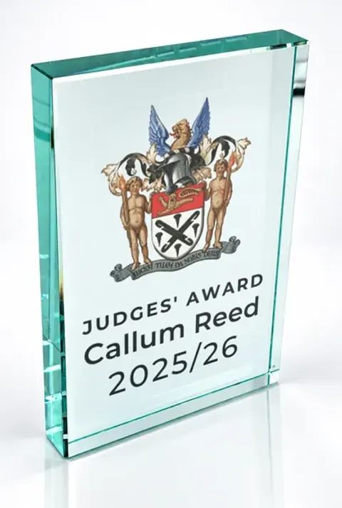 Large portrait glass award printed with a club crest and the wording Judges' Award, Callum Reed, 2025/26