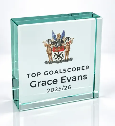 Small square glass award printed with a club crest and the wording Top Goalscorer, Grace Evans, 2025/26