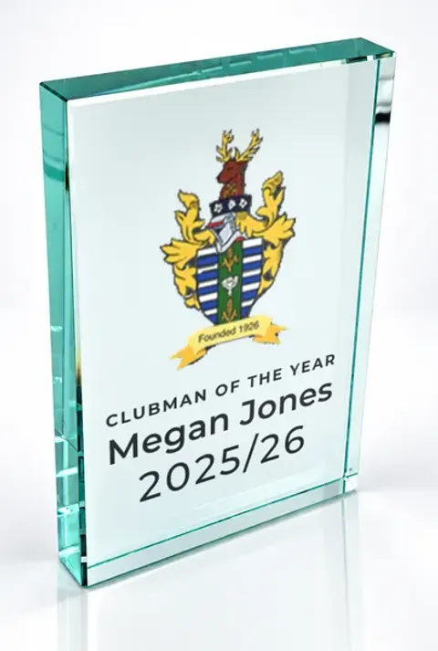 Large portrait glass award printed with a club crest and the wording Clubman Of The Year, Megan Jones, 2025/26