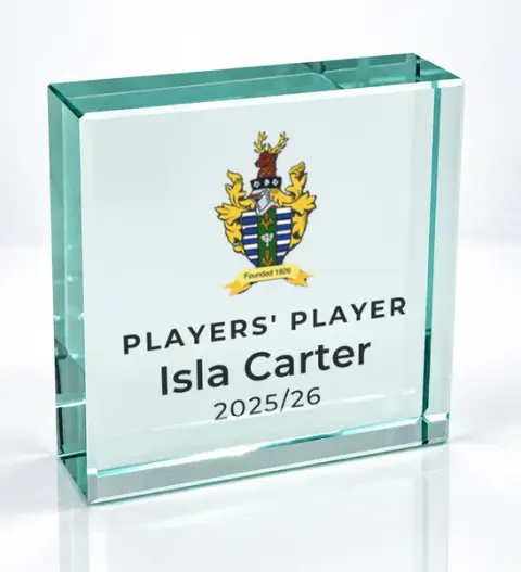 Small square glass award printed with a club crest and the wording Players' Player, Isla Carter, 2025/26