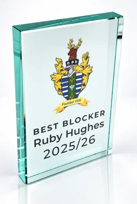 Large portrait glass award printed with a club crest and the wording Best Blocker, Ruby Hughes, 2025/26