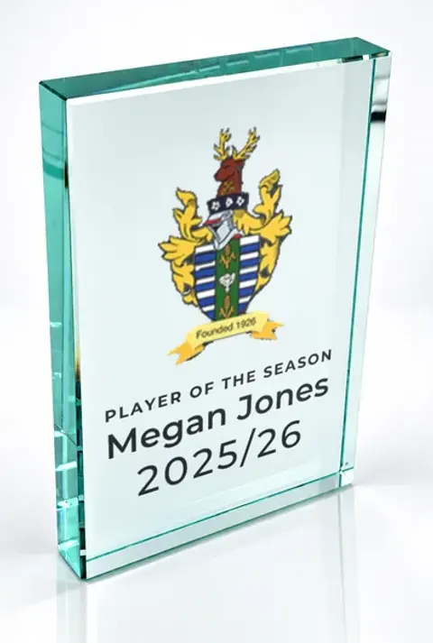 Large portrait glass award printed with a club crest and the wording Player Of The Season, Megan Jones, 2025/26