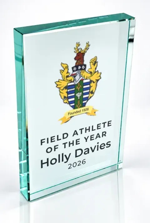 Large portrait glass award printed with a club crest and the wording Field Athlete Of The Year, Holly Davies, 2026