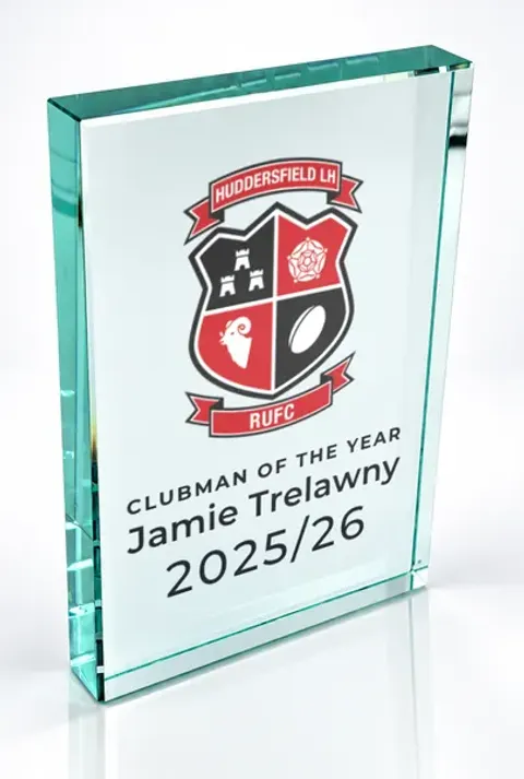 Large portrait glass award printed with a club crest and the wording Clubman Of The Year, Jamie Trelawny, 2025/26