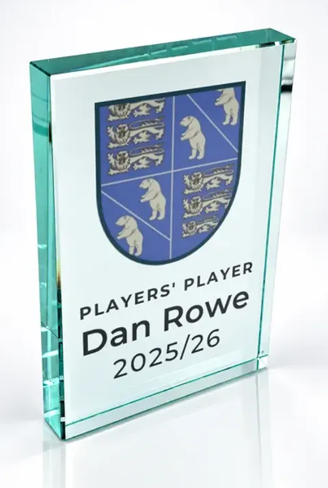 Large portrait glass award printed with a club crest and the wording Players' Player, Dan Rowe, 2025/26