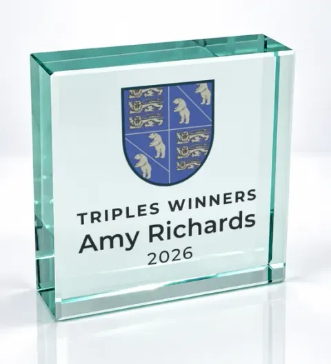 Small square glass award printed with a club crest and the wording Triples Winners, Amy Richards, 2026