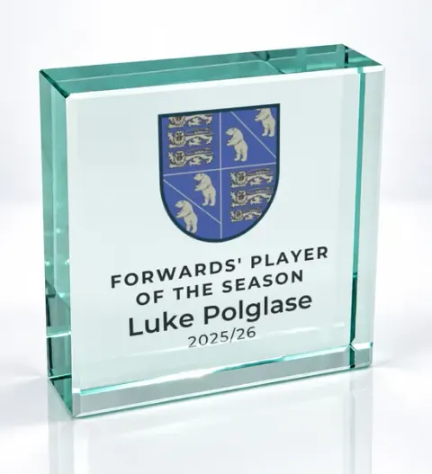 Small square glass award printed with a club crest and the wording Forwards' Player Of The Season, Luke Polglase, 2025/26