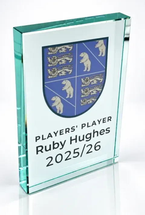 Large portrait glass award printed with a club crest and the wording Players' Player, Ruby Hughes, 2025/26