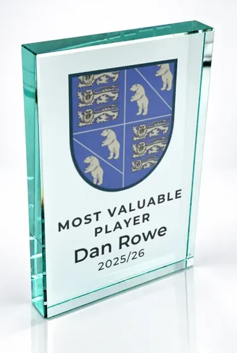 Large portrait glass award printed with a club crest and the wording Most Valuable Player, Dan Rowe, 2025/26