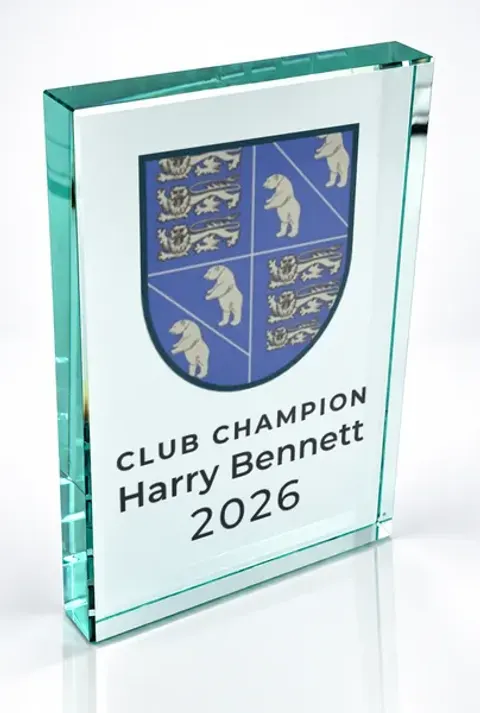 Large portrait glass award printed with a club crest and the wording Club Champion, Harry Bennett, 2026