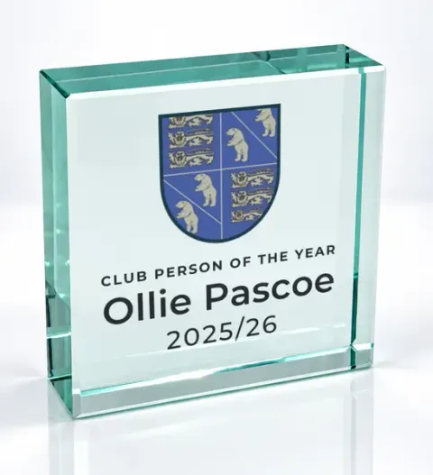 Small square glass award printed with a club crest and the wording Club Person Of The Year, Ollie Pascoe, 2025/26
