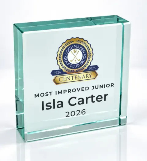 Small square glass award printed with a club crest and the wording Most Improved Junior, Isla Carter, 2026