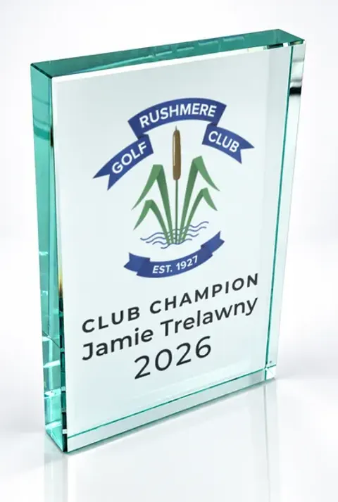 Large portrait glass award printed with a club crest and the wording Club Champion, Jamie Trelawny, 2026