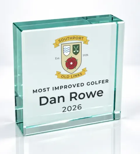 Small square glass award printed with a club crest and the wording Most Improved Golfer, Dan Rowe, 2026