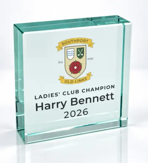 Small square glass award printed with a club crest and the wording Ladies' Club Champion, Harry Bennett, 2026