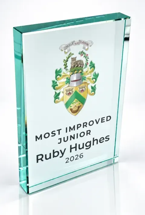 Large portrait glass award printed with a club crest and the wording Most Improved Junior, Ruby Hughes, 2026