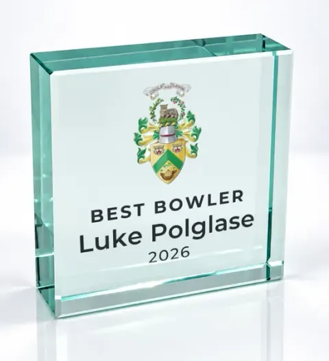 Small square glass award printed with a club crest and the wording Best Bowler, Luke Polglase, 2026