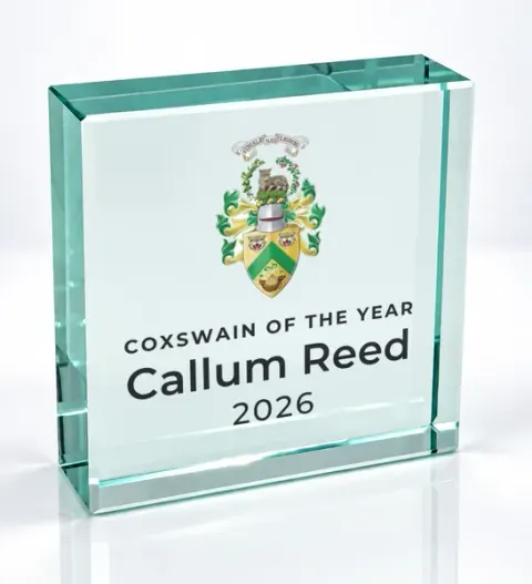 Small square glass award printed with a club crest and the wording Coxswain Of The Year, Callum Reed, 2026