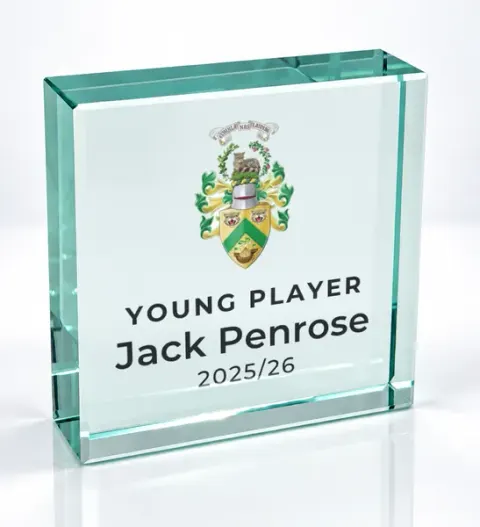Small square glass award printed with a club crest and the wording Young Player, Jack Penrose, 2025/26