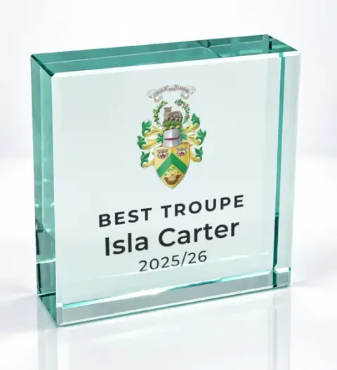 Small square glass award printed with a club crest and the wording Best Troupe, Isla Carter, 2025/26
