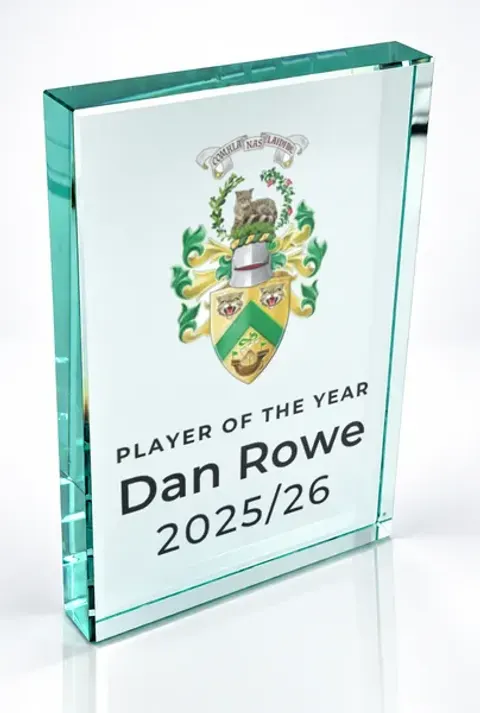 Large portrait glass award printed with a club crest and the wording Player Of The Year, Dan Rowe, 2025/26