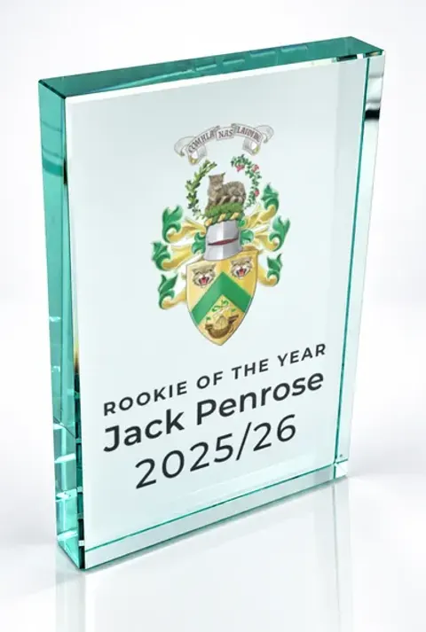 Large portrait glass award printed with a club crest and the wording Rookie Of The Year, Jack Penrose, 2025/26