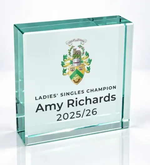 Small square glass award printed with a club crest and the wording Ladies' Singles Champion, Amy Richards, 2025/26