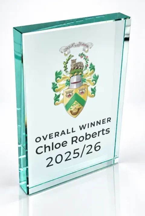 Large portrait glass award printed with a club crest and the wording Overall Winner, Chloe Roberts, 2025/26