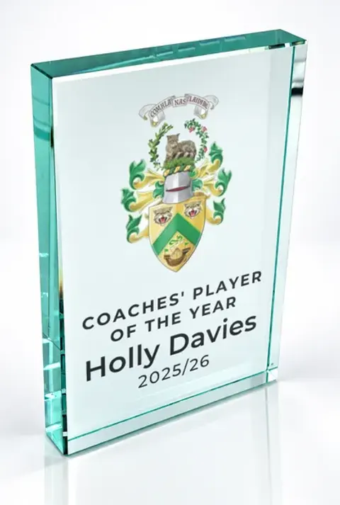 Large portrait glass award printed with a club crest and the wording Coaches' Player Of The Year, Holly Davies, 2025/26
