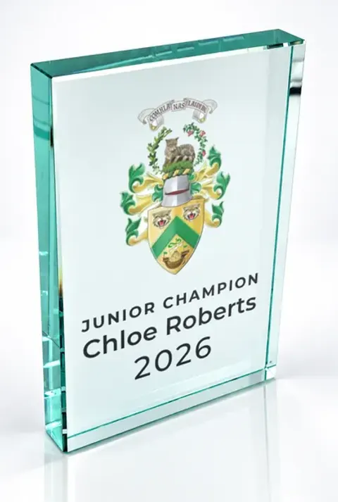 Large portrait glass award printed with a club crest and the wording Junior Champion, Chloe Roberts, 2026