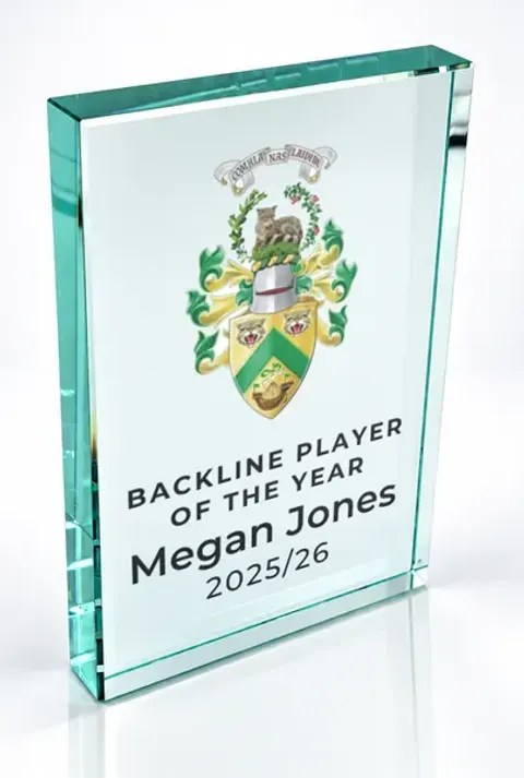 Large portrait glass award printed with a club crest and the wording Backline Player Of The Year, Megan Jones, 2025/26
