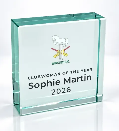 Small square glass award printed with a club crest and the wording Clubwoman Of The Year, Sophie Martin, 2026